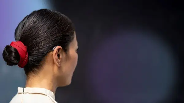 women wearing signia pure charge&go ix hearing aid small, sleek, discreet new signia ix hearing aid