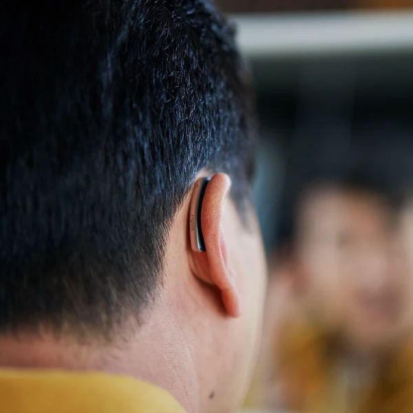 man wearing signia styletto connect hearing aids behind the ear hearing aids