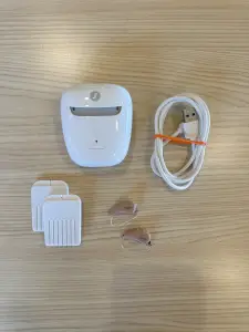 used signia 7ix hearing aids with charger, cord, and wax guards