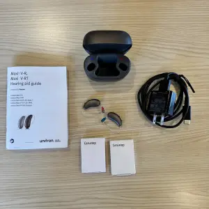 used unitron moxi hearing aids with charger, wax guards, etc