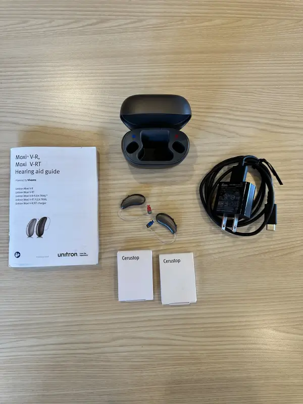 used unitron moxi hearing aids with charger, wax guards, etc